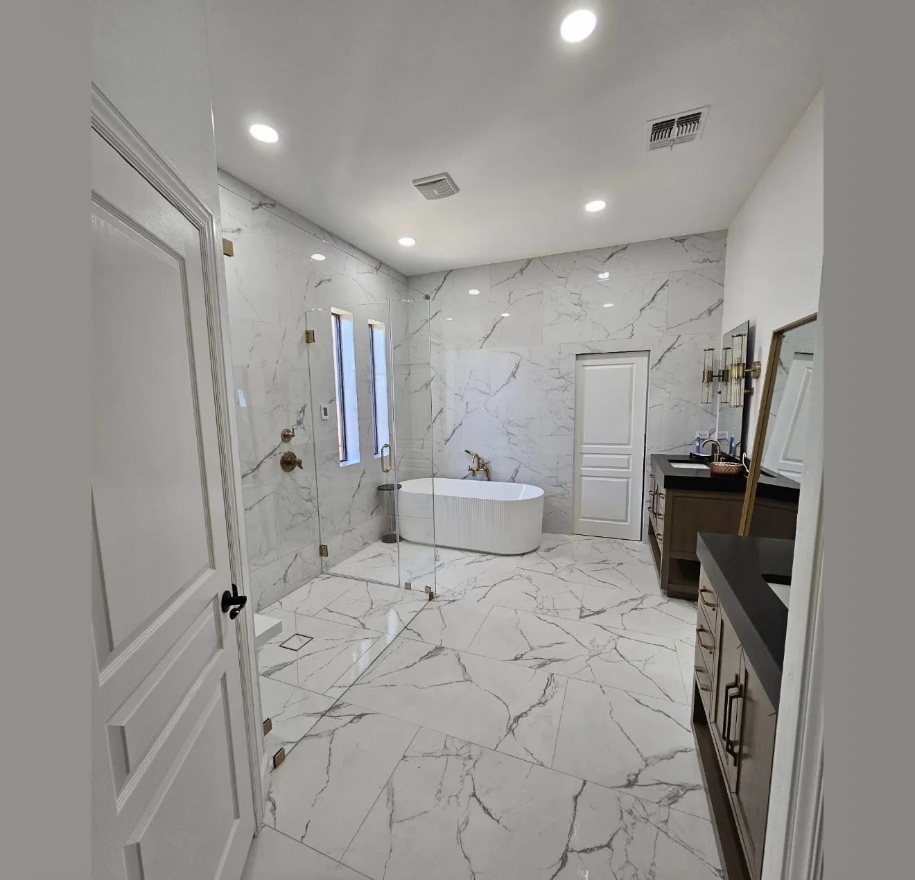 Bathroom with a marble-look shower and vanity