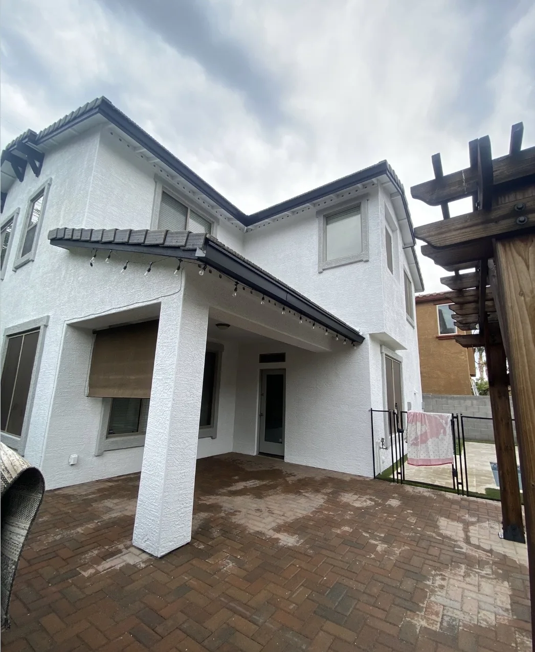 White stucco home with a covered patio