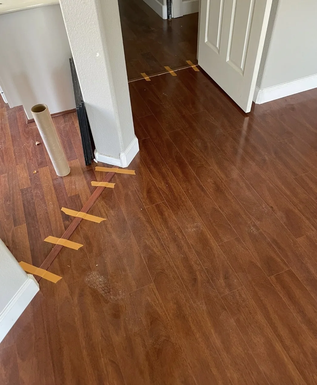 Wood flooring meeting a doorway threshold