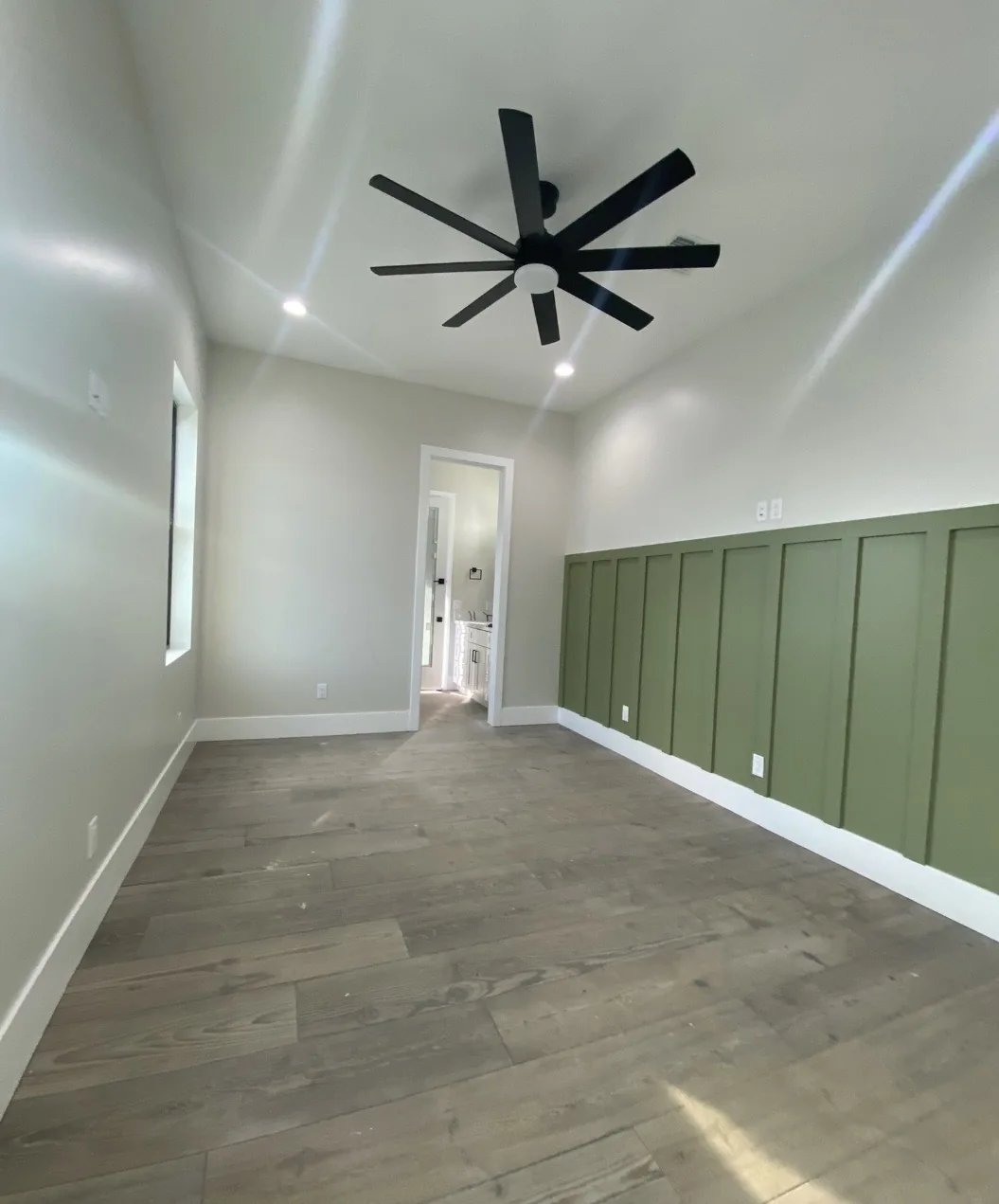 Interior room with green paneled wainscoting